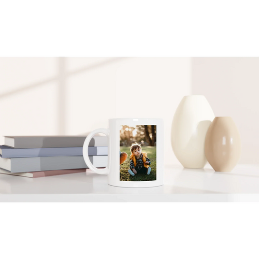 A photo of a custom made mug with a custom photo of a kid on it